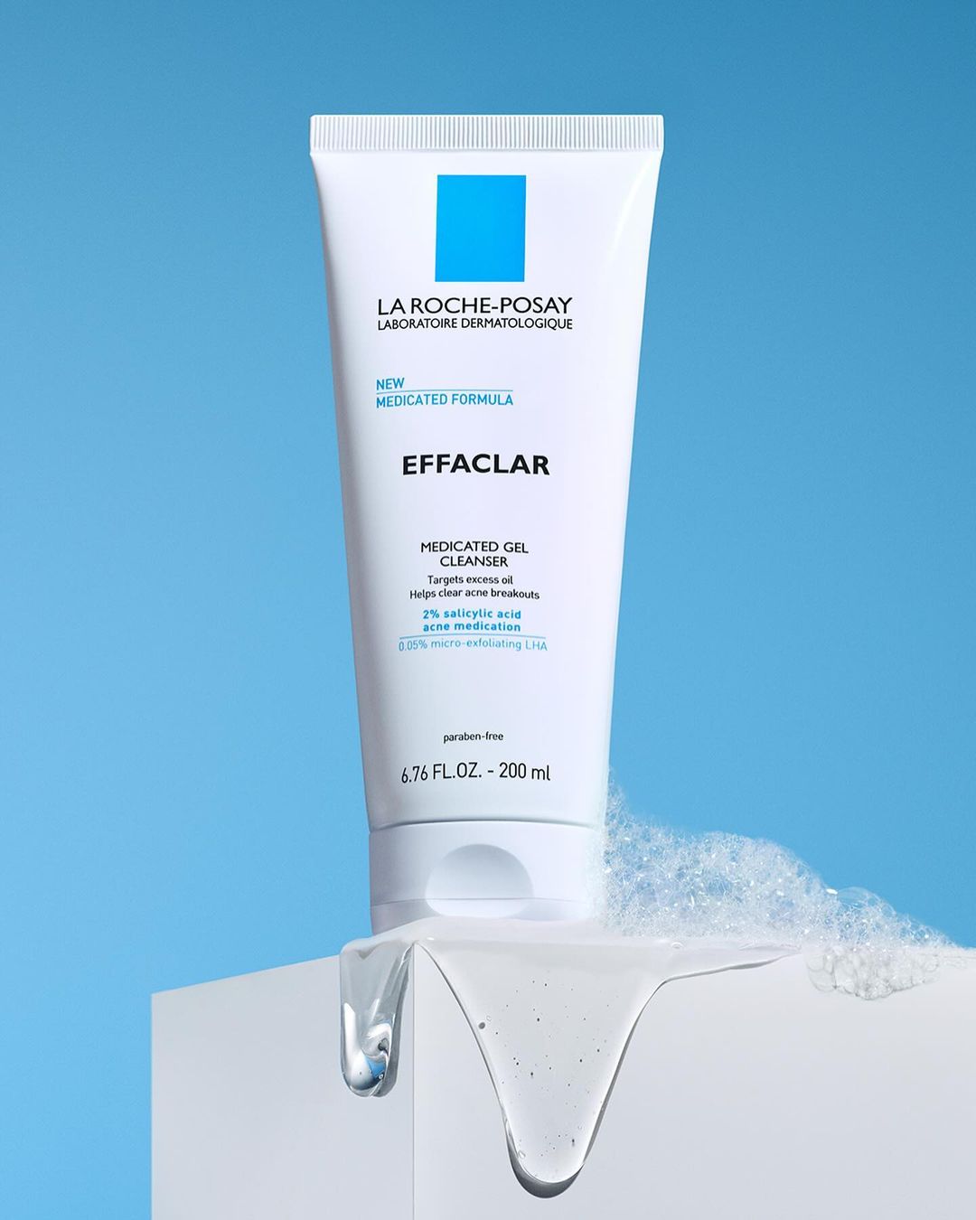 La Roche-Posay Effaclar medicated gel cleanser in a white tube on a white surface, against a light blue background.