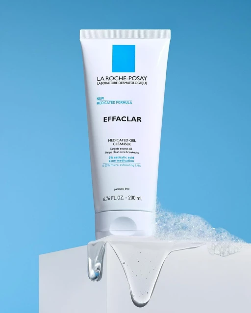 La Roche-Posay Effaclar medicated gel cleanser in a white tube on a white surface, against a light blue background.