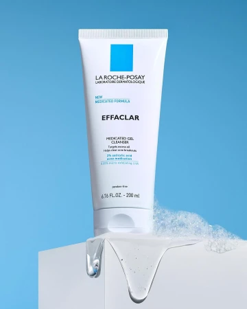 La Roche-Posay Effaclar medicated gel cleanser in a white tube on a white surface, against a light blue background.
