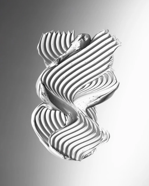 Textured silver cream swirls and ridges in abstract composition. Close-up studio shot on gray gradient background creates a smooth, shiny effect.