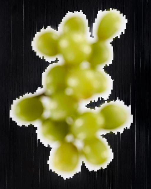 Overhead shot of a blurry, abstract-style image of a bunch of green grapes on a black background with vertical lines.