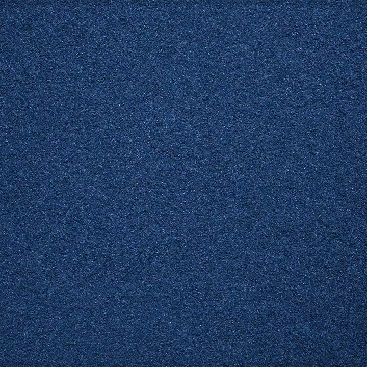 Close-up view of deep blue velvet fabric texture, suitable as a background or design element, highlighting its soft, uniform surface.