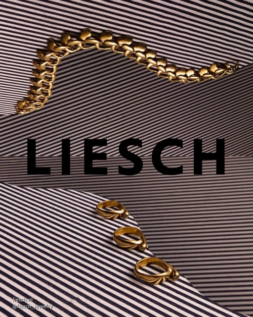 Promotional still life product shot featuring gold jewelry, including a bracelet and rings, displayed on a striped surface.