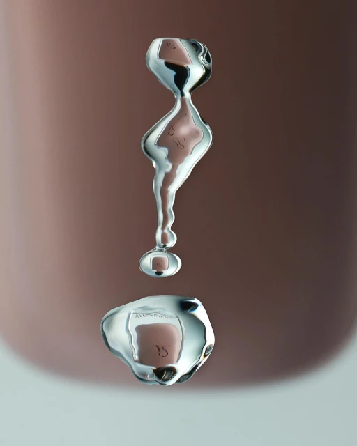 Abstract macro photograph of water droplets suspended in air against a blurred gradient background, with surface tension creating unique forms.
