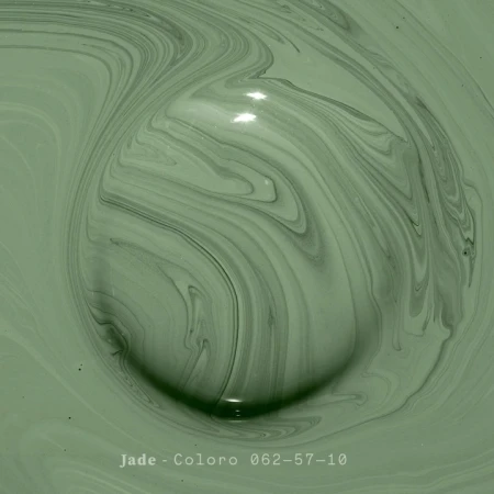 Macro abstract of swirling, light green paint with dark green marbling and shadows creates a soothing, organic, and textured visual.