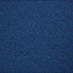 Close-up of a dark blue textured fabric surface with a dense woven or felted grain pattern filling the frame.