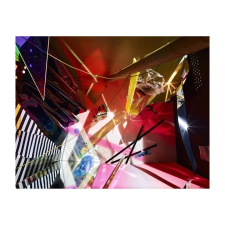 Abstract studio photograph of colorful cellophane, geometric shapes, and linear forms with directed light and dark shadows.