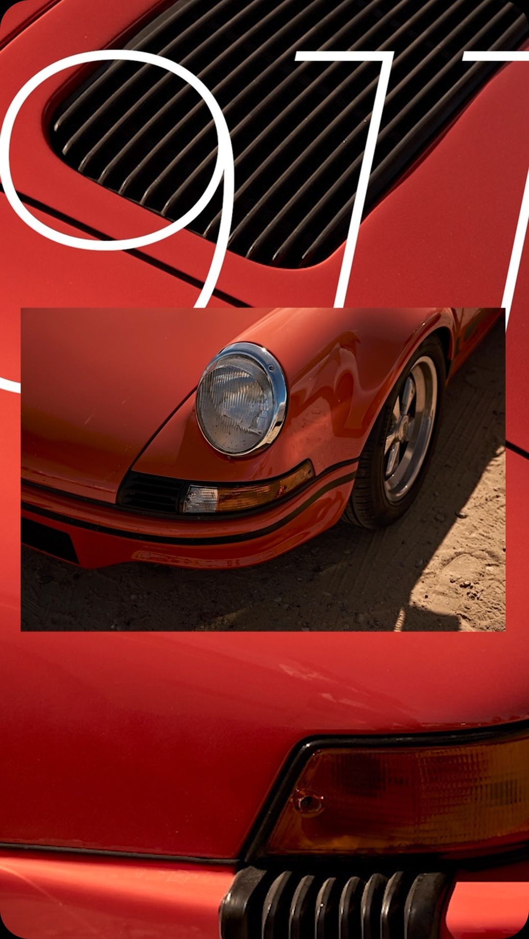 Close-up of a red Porsche 911 with a vintage aesthetic, focusing on the car's hood, headlight, and front bumper against a sandy backdrop.