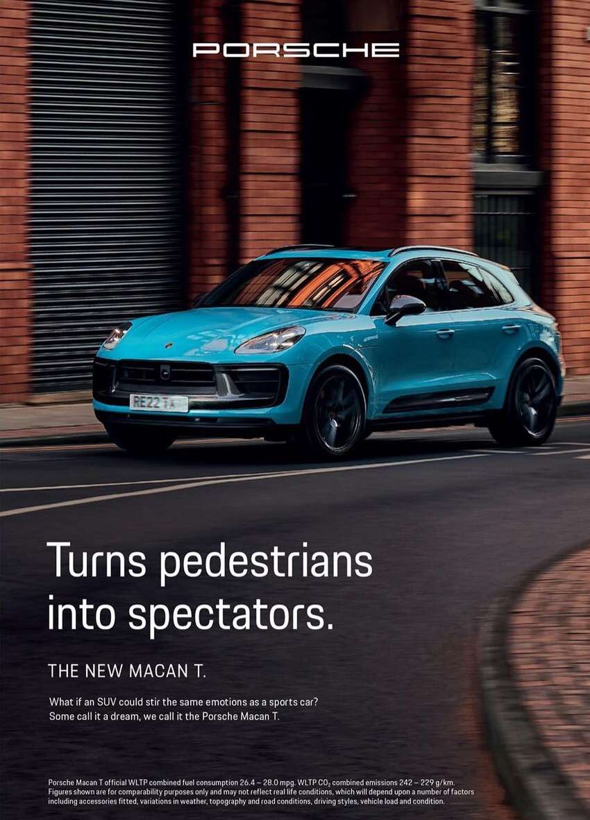 A turquoise Porsche Macan T SUV speeds along an urban street, showcased against a blurred brick building backdrop in a car advertisement.