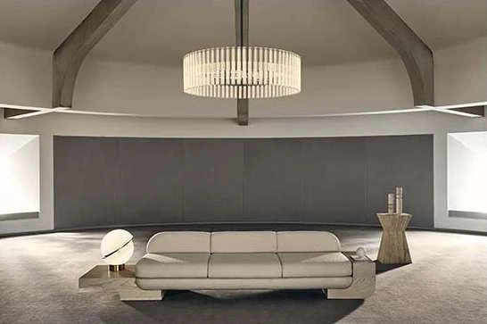 Contemporary living room interior showcasing a cream-colored sofa, circular light fixture, and architectural beams in a minimalist space.