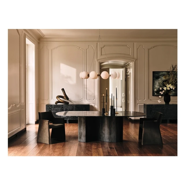 Interior design featuring a formal dining room with a marble table, black chairs, and modern chandelier in a neutral color scheme.