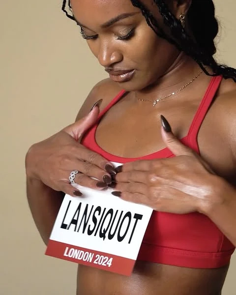 Brunette female athlete in a red sports bra holds a card in front of her body, with the text 'LANSIQUOT LONDON 2024' on a beige background.