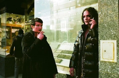 Two people smoking outside a storefront in New York, directed by Ben Draghi