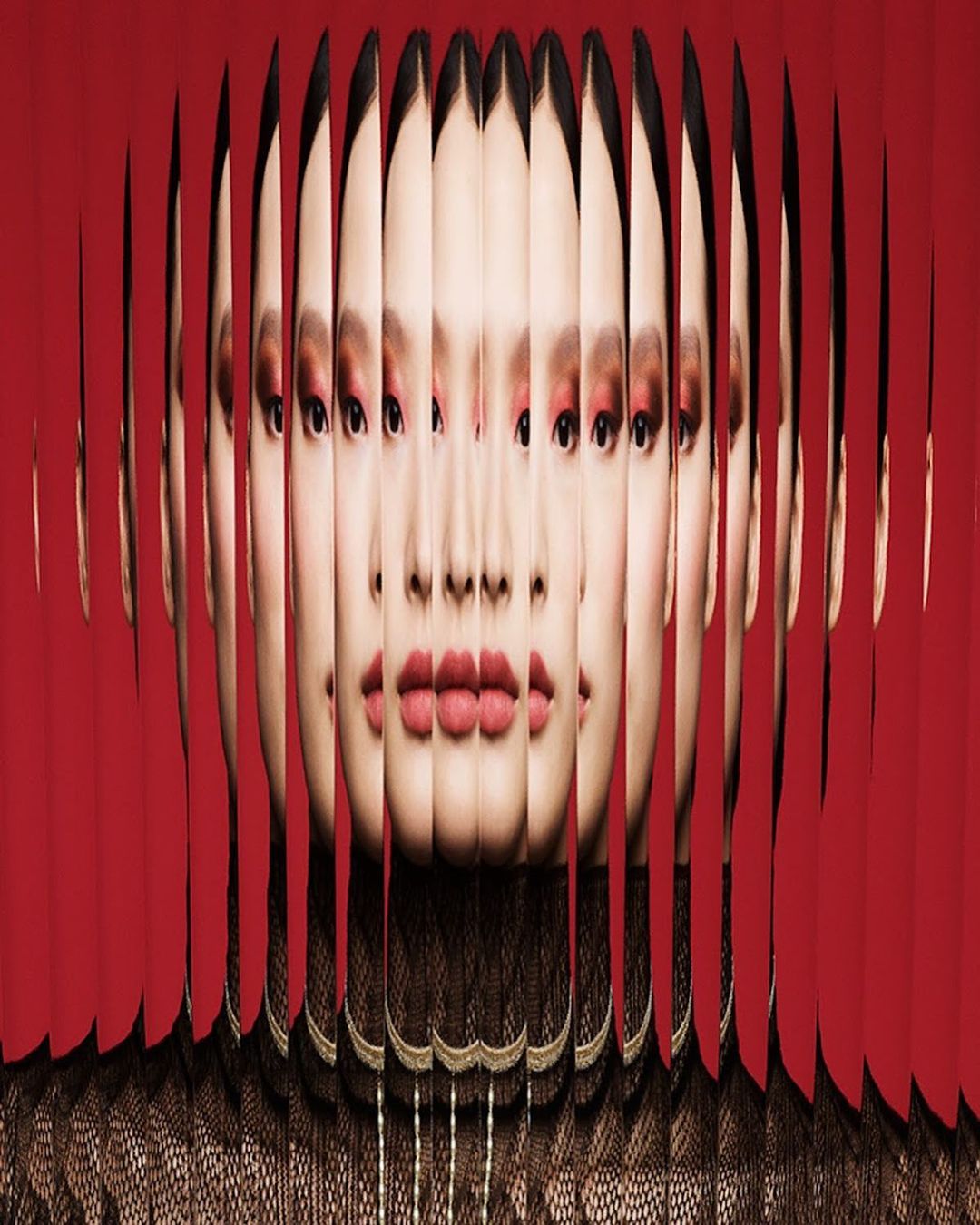 Abstract portrait of an Asian woman with multiple face fragments, red eye makeup, and lips. Dark brown patterned top, red studio backdrop.