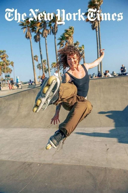 A person is roller skating on a sunny day at the skate park, with the New York Times logo in the upper portion of the frame.