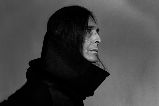 Black and white portrait of a woman in profile wearing a dark hooded garment captured in Los Angeles by photographer Kasey Priest