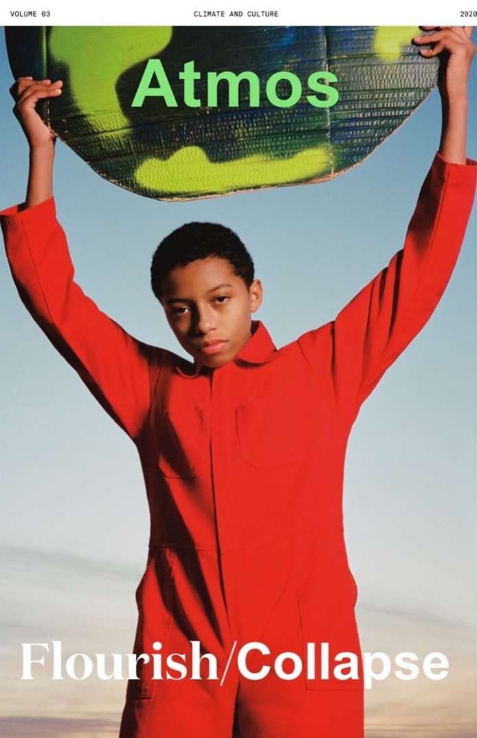Teenager in red jumpsuit poses with a green earth-like object against a blue sky, with 'Atmos' and 'Flourish/Collapse' text.