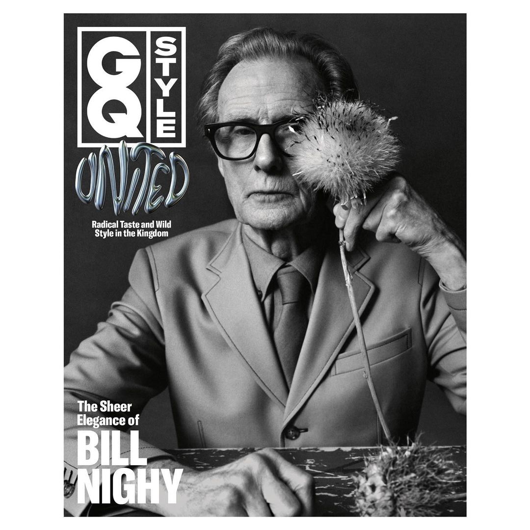 Black and white portrait of older adult male in suit holding fuzzy plant for magazine cover with GQ Style logo and Bill Nighy text.
