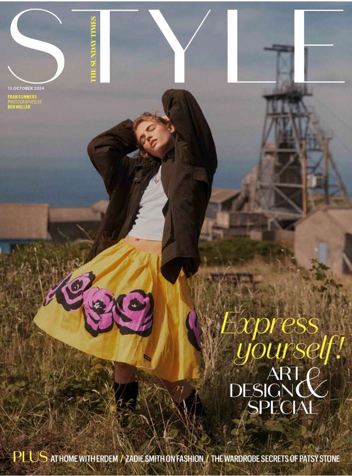 The Sunday Times Style cover featuring a woman in a yellow skirt with black roses posing in a grassy field with a mine in the background.