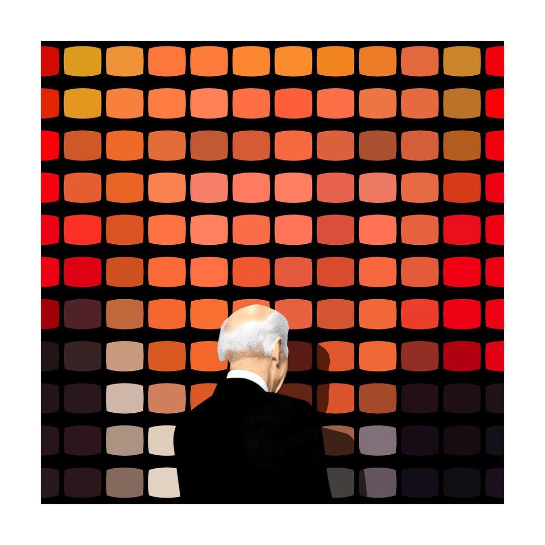 Back view of a man in a black suit looking at a colorful grid pattern on a wall, with shades of orange and brown.