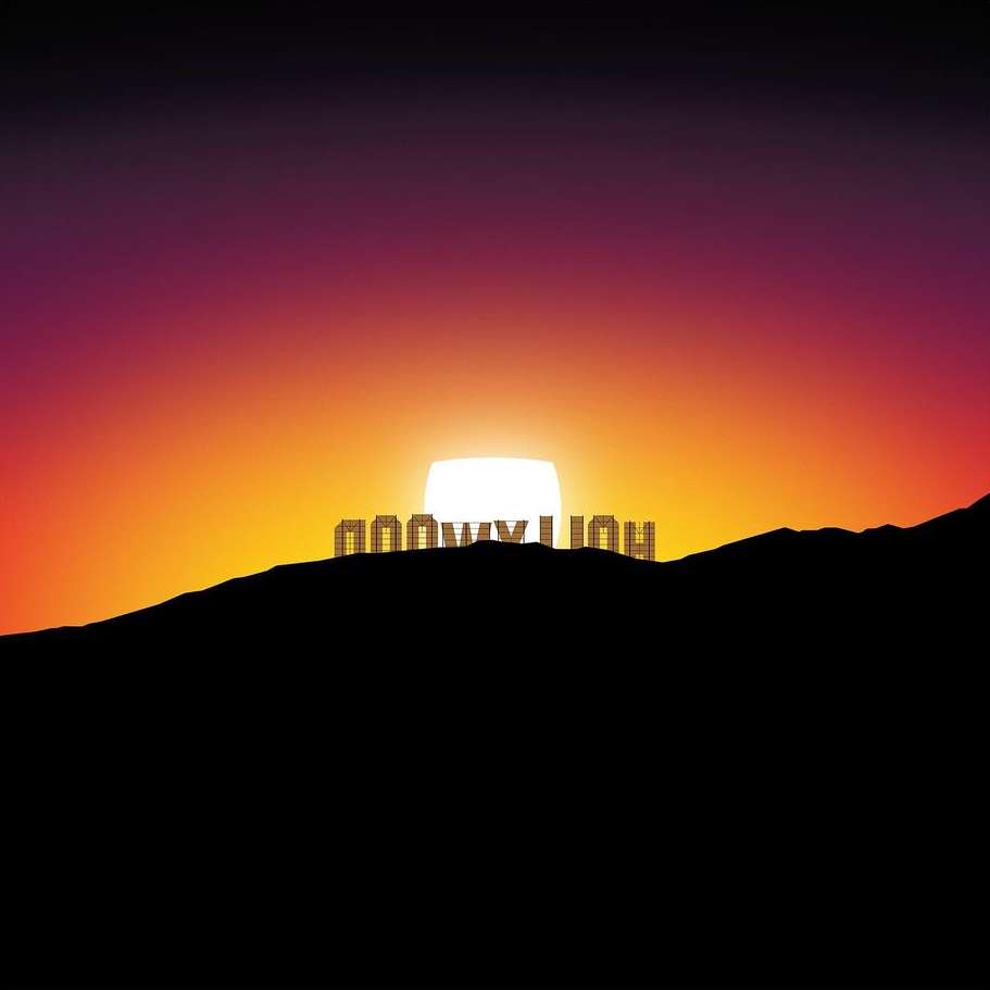 Hollywood sign silhouette on a hilltop against a bright sunset sky with vibrant shades of orange, purple and pink.