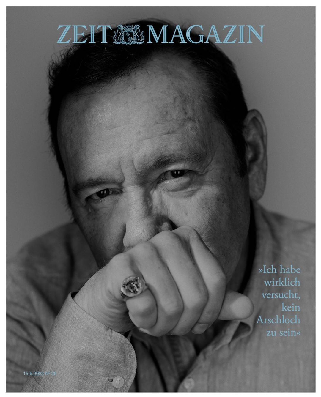 Zeit Magazin magazine cover featuring a close-up portrait of a man with a ring on his finger covering part of his face.