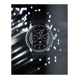 Close-up product photograph of a luxury wristwatch with a starfield dial and dark fabric strap by Benedict Morgan.