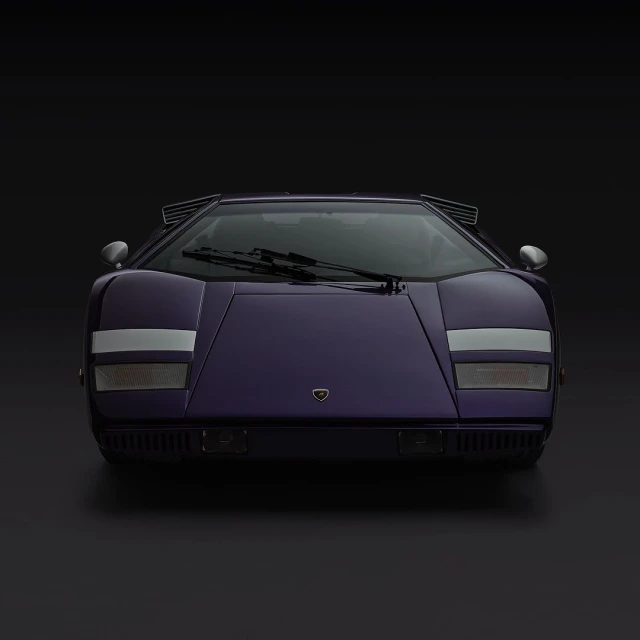 Frontal view of a purple Lamborghini Countach against a dark background, showcasing its iconic wedge shape and distinctive styling.