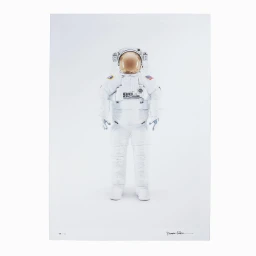 An astronaut in a bulky white spacesuit with a reflective golden visor standing against a plain white background.