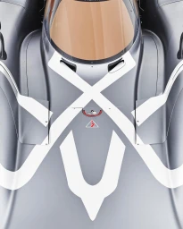 Top-down view of a grey racing car hood featuring bold white geometric markings and a tinted windshield.