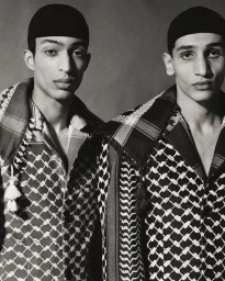 Two men wearing matching keffiyeh patterned jackets and black caps photographed by Benjamin Alexander Huseby