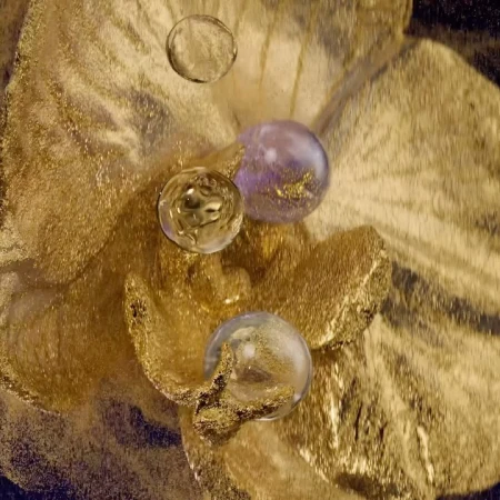 A textured gold surface with shimmering clear and purple orbs creates an abstract, opulent scene.