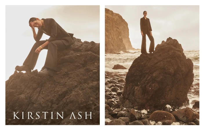 Two fashion images of a person in a dark suit sitting and standing on rocks near the sea. Apparel brand campaign.