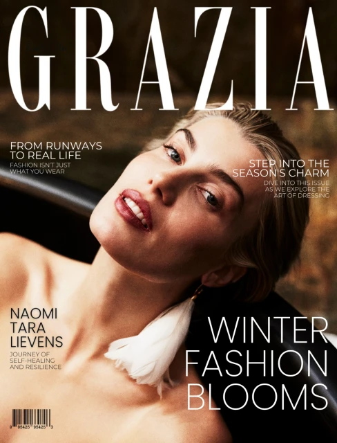 Grazia magazine cover features model Naomi Tara Lievens with feathered earring, promoting winter fashion blooms, in close-up shot.