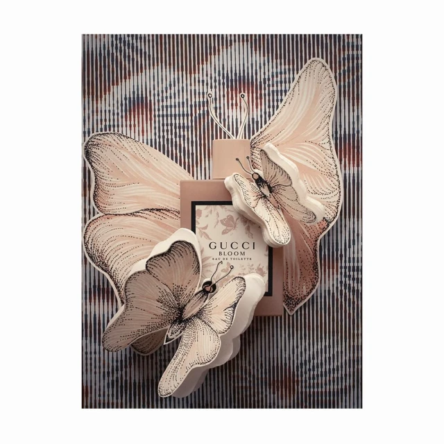 Gucci Bloom Eau de Toilette fragrance, soft color palette, butterfly accents, studio lighting, and sophisticated presentation.