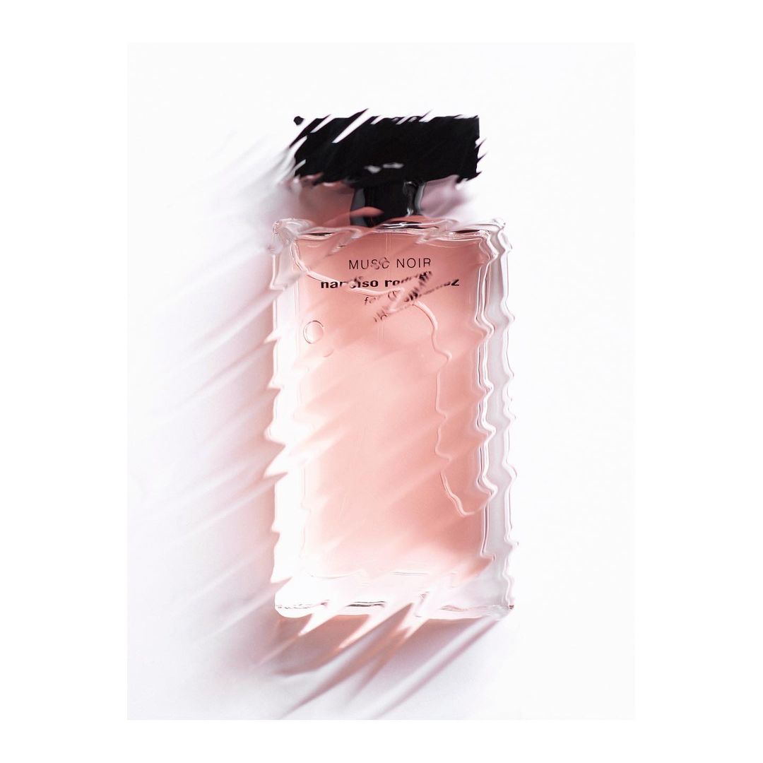 Studio shot of Musc Noir perfume bottle by Narciso Rodriguez with soft lighting, capturing its elegant design and presentation.