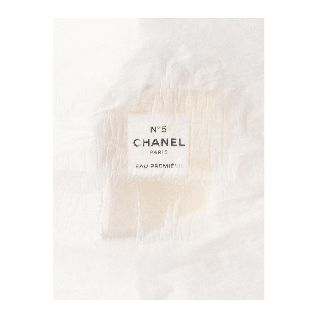 Chanel N°5 Eau Première perfume bottle. Elegant presentation with visible branding. Beauty and fashion imagery.