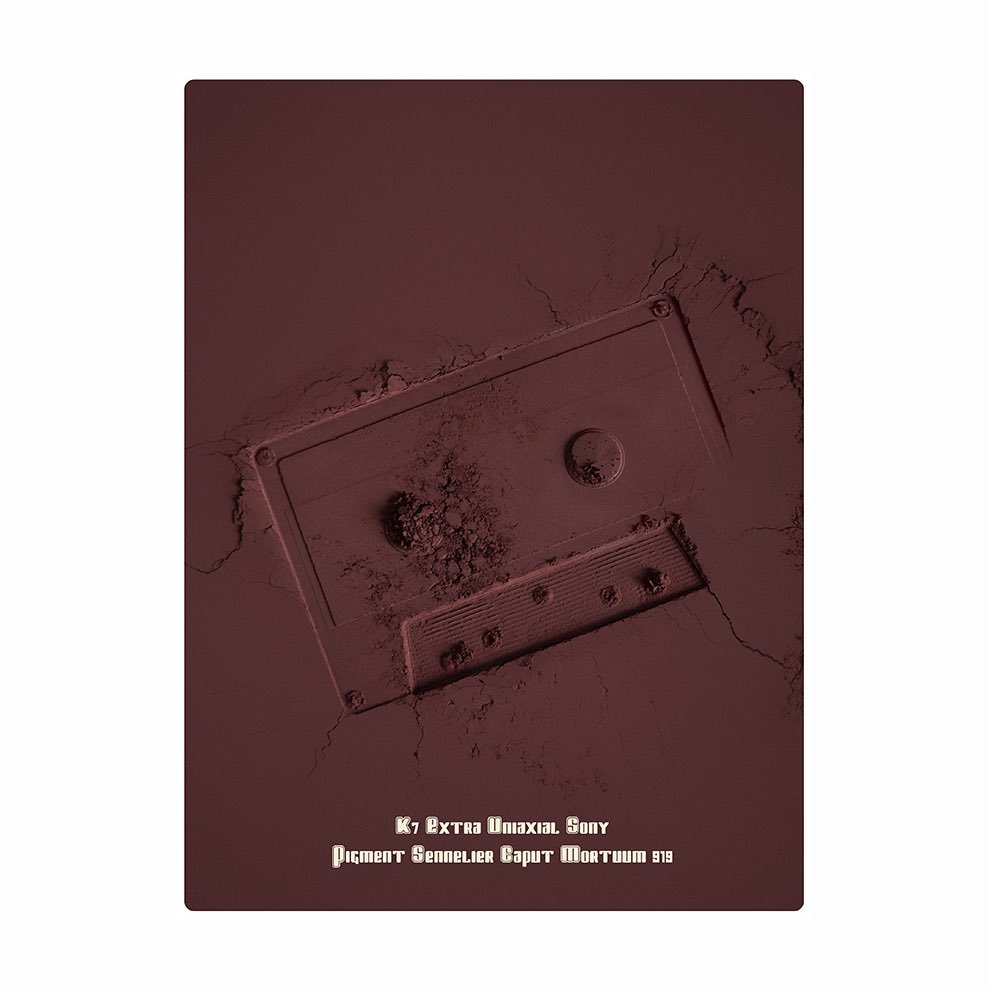 Vintage audio cassette tape artfully depicted with pigmented powder, showcasing a unique blend of retro media and artistic expression.