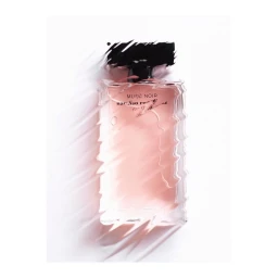 Distorted glass perfume bottle with a dark cap against a plain white background by photographer Beréngere Valognes