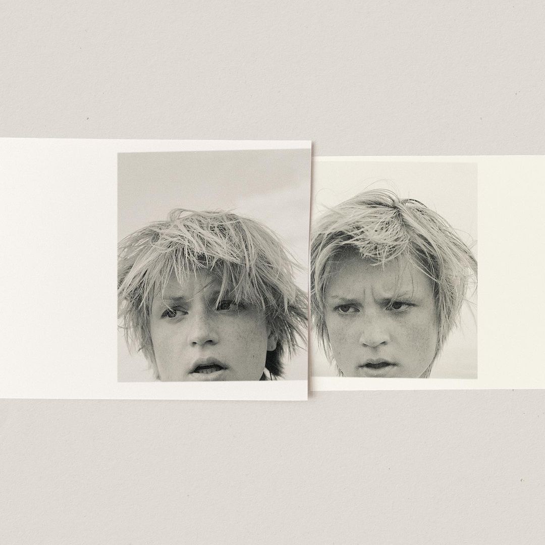 Two overlapping black and white photographic prints featuring close-ups of a young person with tousled hair against a plain background
