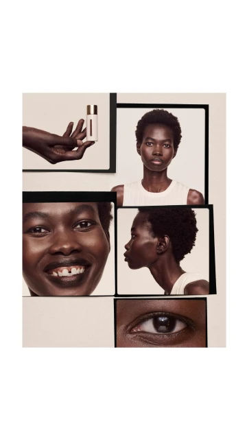 Beauty product shot: Dark-skinned woman with close-up portraits in black frames, holding a lotion bottle. Beige background, studio lighting.