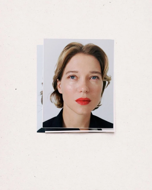 Studio shot of a blonde woman with red lipstick wearing a black blazer, presented as printed photograph duplicates on a white surface.