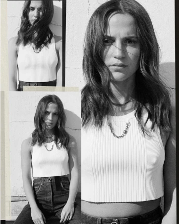 Monochrome shot of a woman with long hair wearing a white top and jeans, posing in front of a textured wall in three panels.