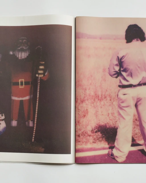 Open pages of a book displaying a Santa Claus figure on one page and a person standing in a field on the other.