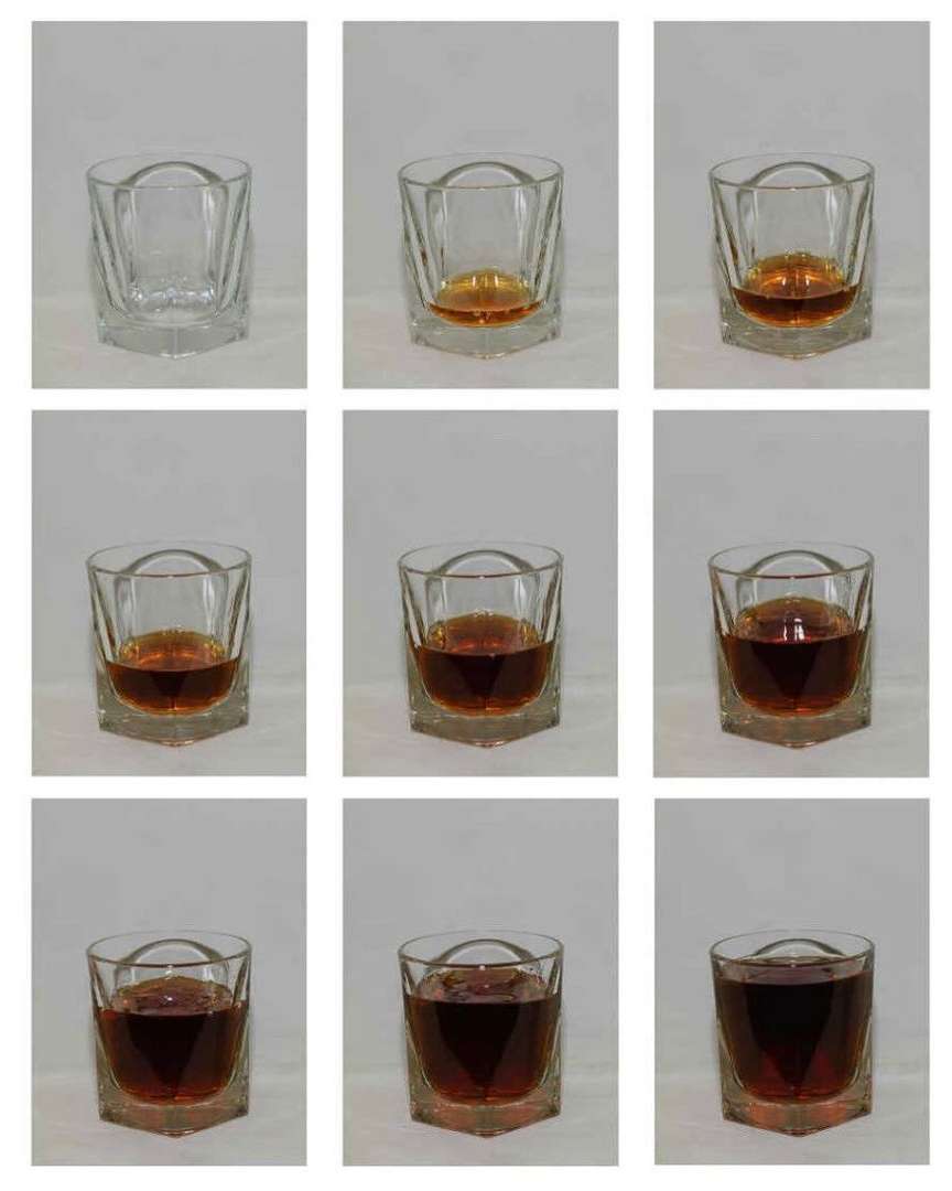 Progression of whiskey being poured into a clear, faceted rocks glass, filling it to the brim across nine sequential frame captures.