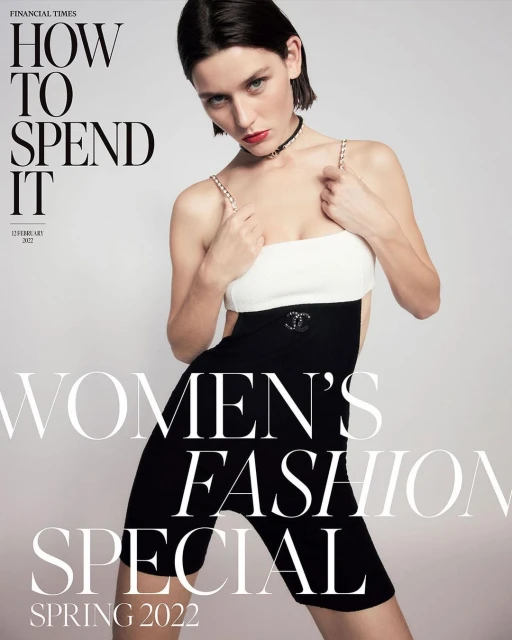 Magazine cover featuring a young woman in a black and white bodysuit with jewelry against a grey background. Text reads: 'Women's Fashion Special'.