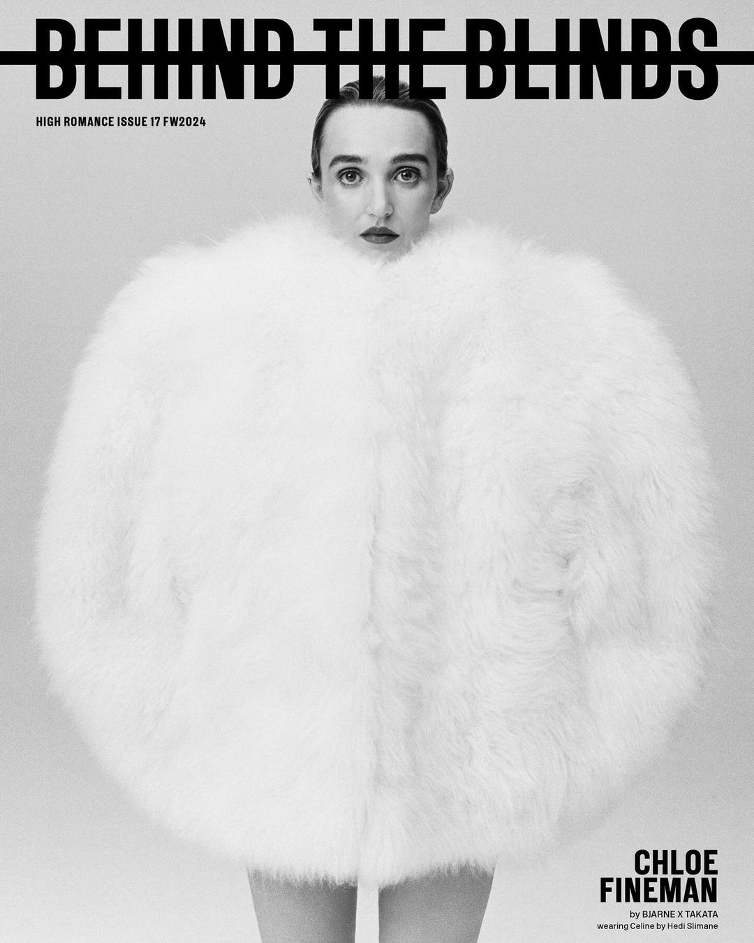 Black and white magazine cover featuring a woman in a large, white, furry coat, with bold text reading 'Behind The Blinds'.