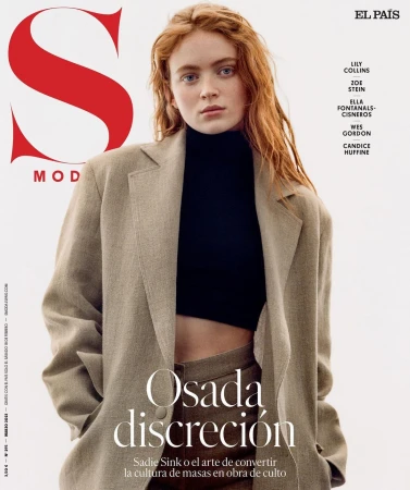 Sadie Sink on magazine cover wearing a beige blazer and black top, set against a bright background with magazine text and logo.