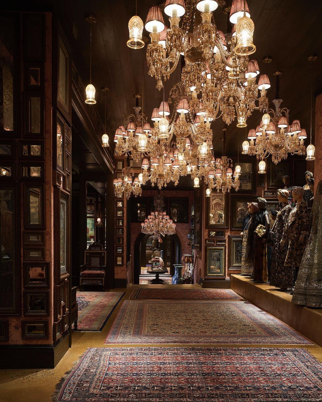 Opulent interior featuring crystal chandeliers, ornate wall decor, and patterned carpets creates a luxurious and captivating visual experience.
