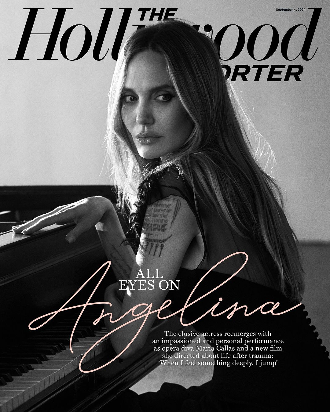Black and white magazine cover featuring Angelina Jolie with long hair and fair skin in soft light, with piano keyboard detail.